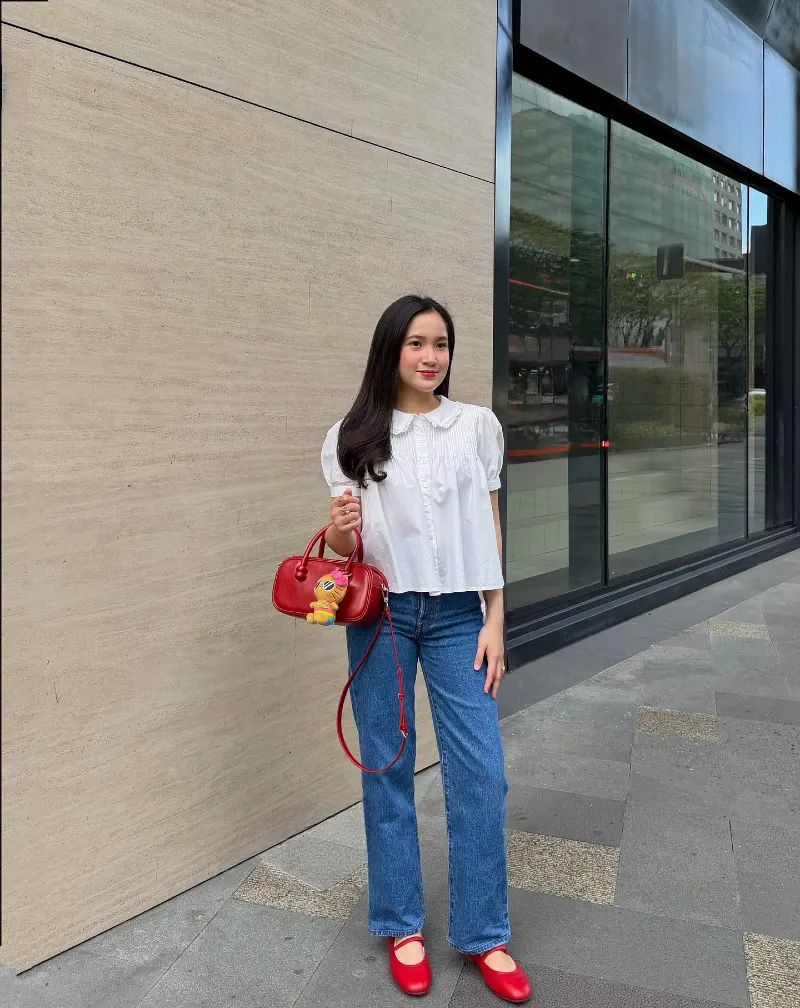 Crisp White Smocked Blouse with Medium Wash Denim and Cherry Red Accents