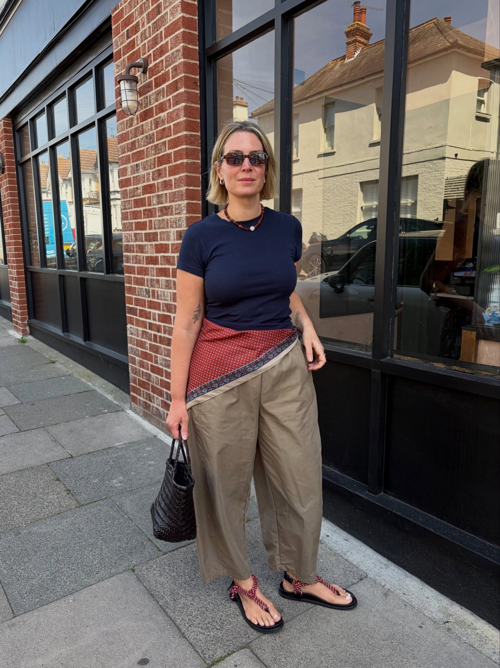 Fitted Navy T-Shirt with Asymmetrical Silk Hip Scarf and Loose Khaki Trousers
