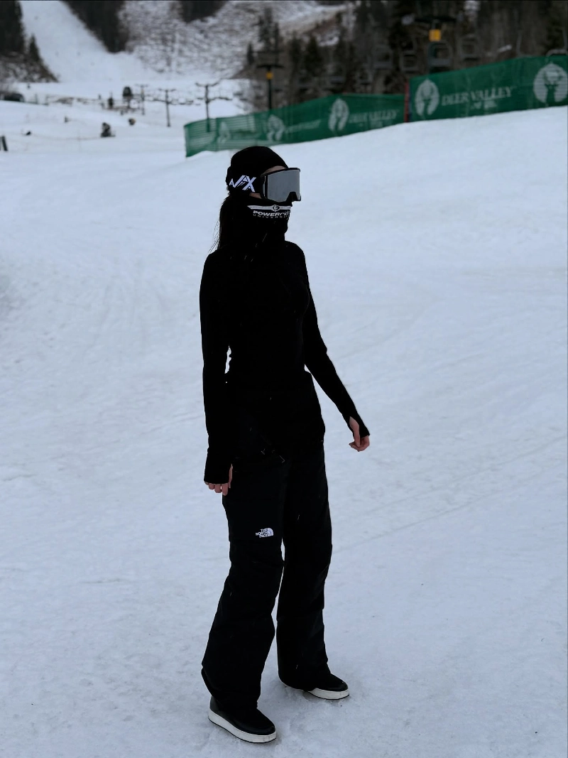 Head-to-Toe Black Technical Ski Outfit with Mirrored Goggles and Face Covering