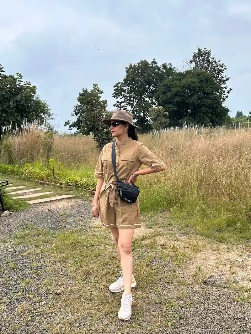 Khaki Utility Romper with Crossbody Bag and White Sneakers
