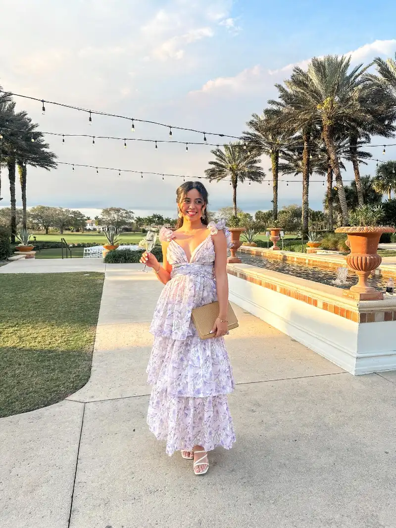 Lilac Tiered Floral V-Neck Maxi Dress with Straw Clutch and Palm Courtyard