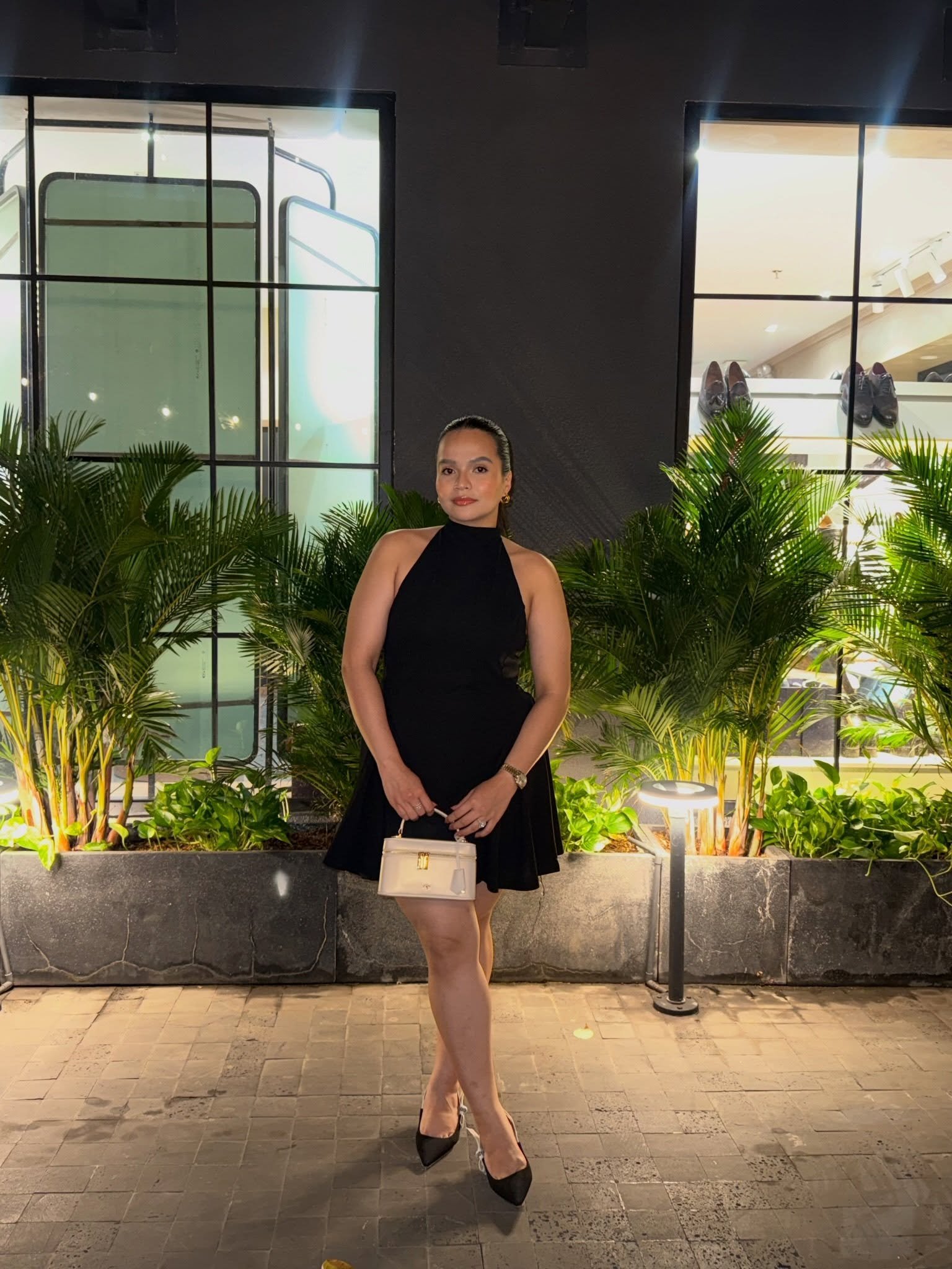 Little Black Dress Against Tropical Foliage