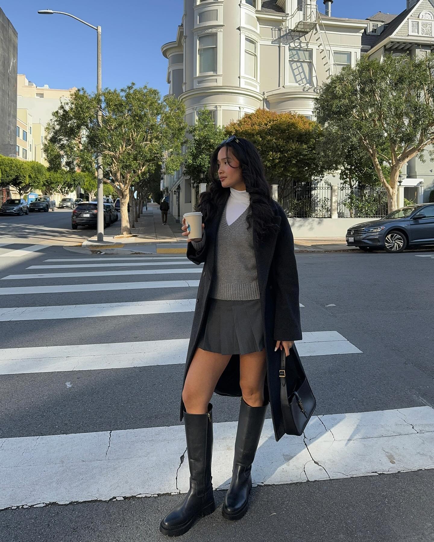 Long Charcoal Wool Coat with V-Neck Sweater Vest and Grey Pleated Mini Skirt Display