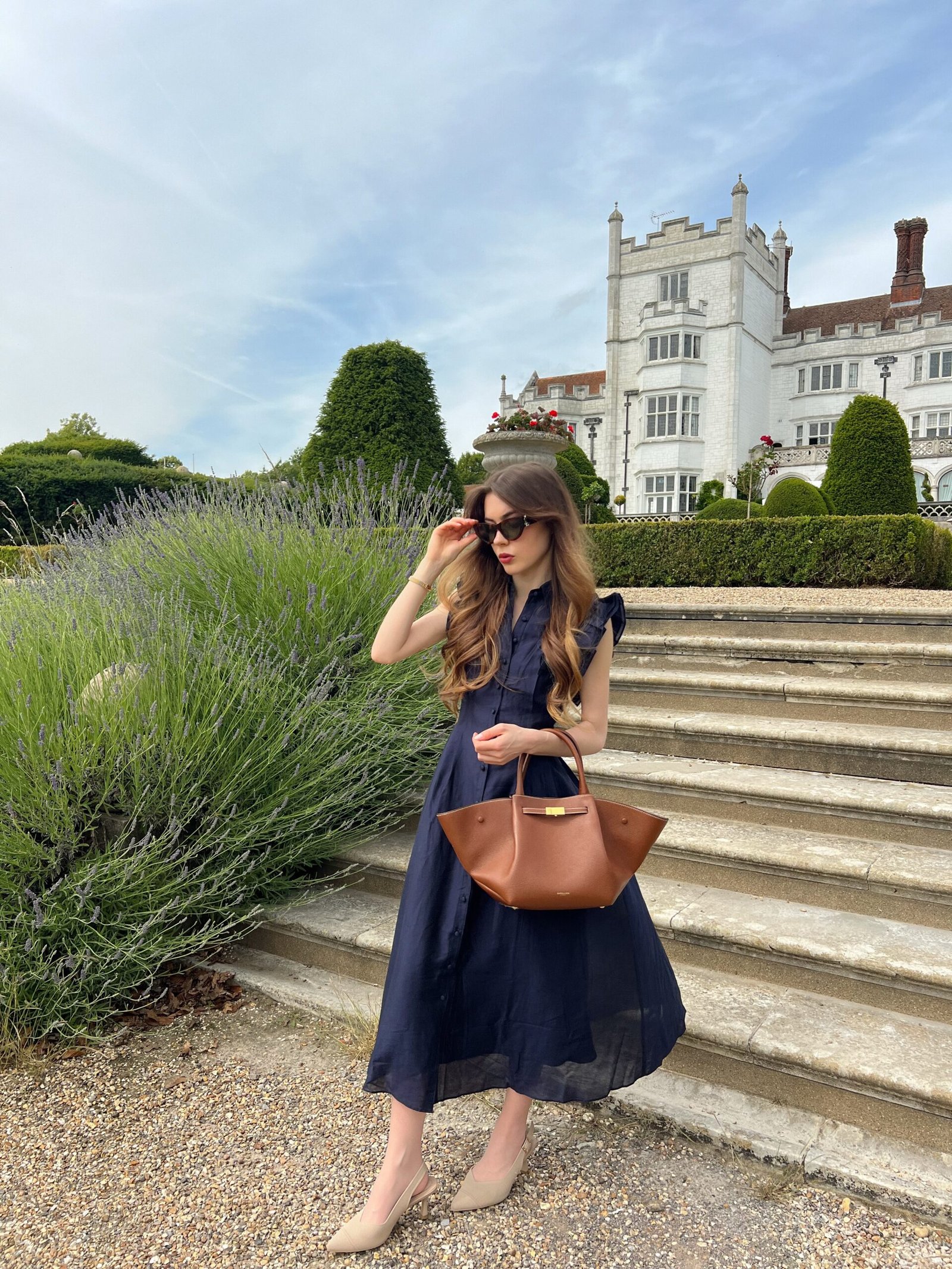 Navy Sleeveless Shirtdress with Flared Cognac Leather Tote