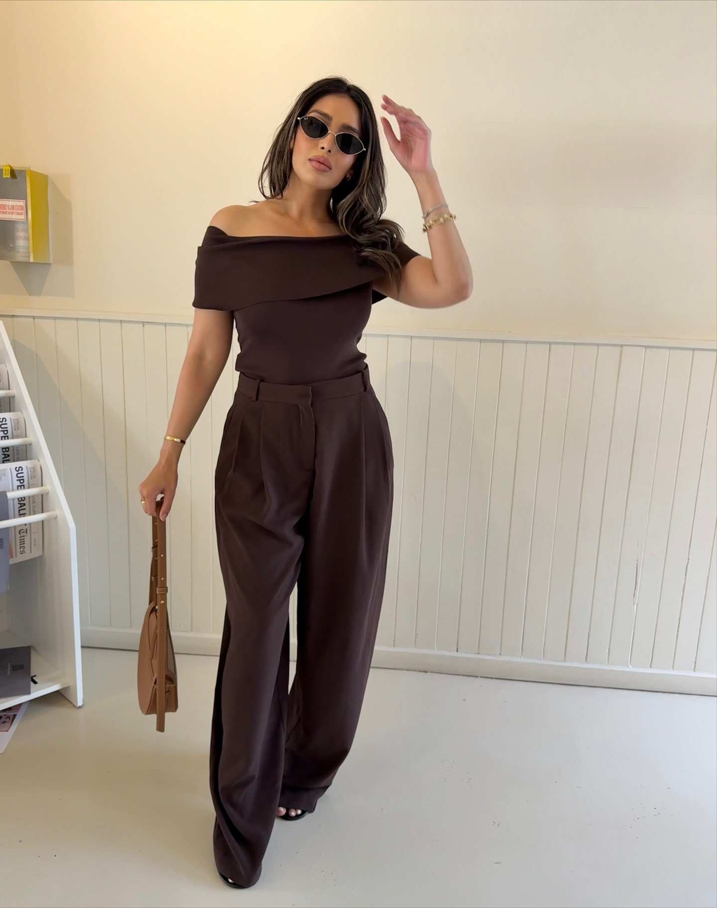 Off-Shoulder Knit Top with High-Waisted Tailored Trousers and Slim Leather Bag