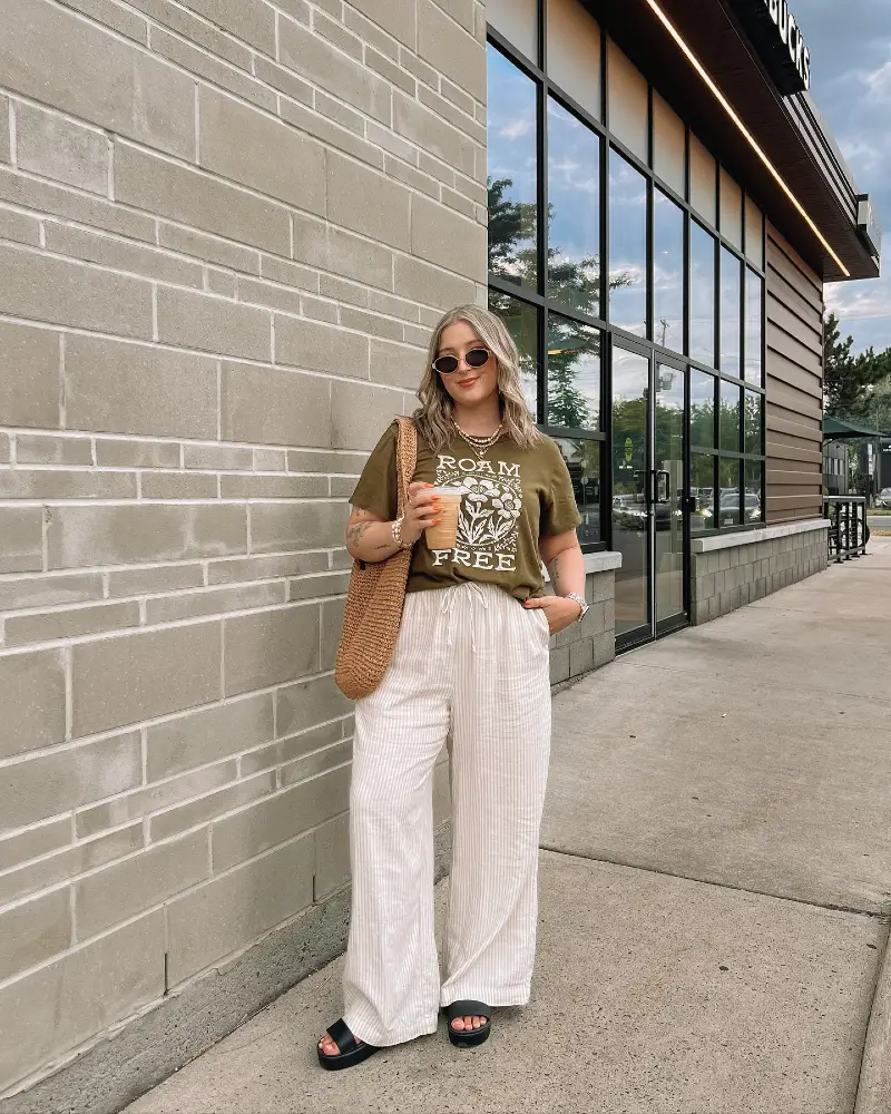 Olive Graphic Tee Tucked into Cream Striped Wide-Leg Pants with Black Platform Sandals
