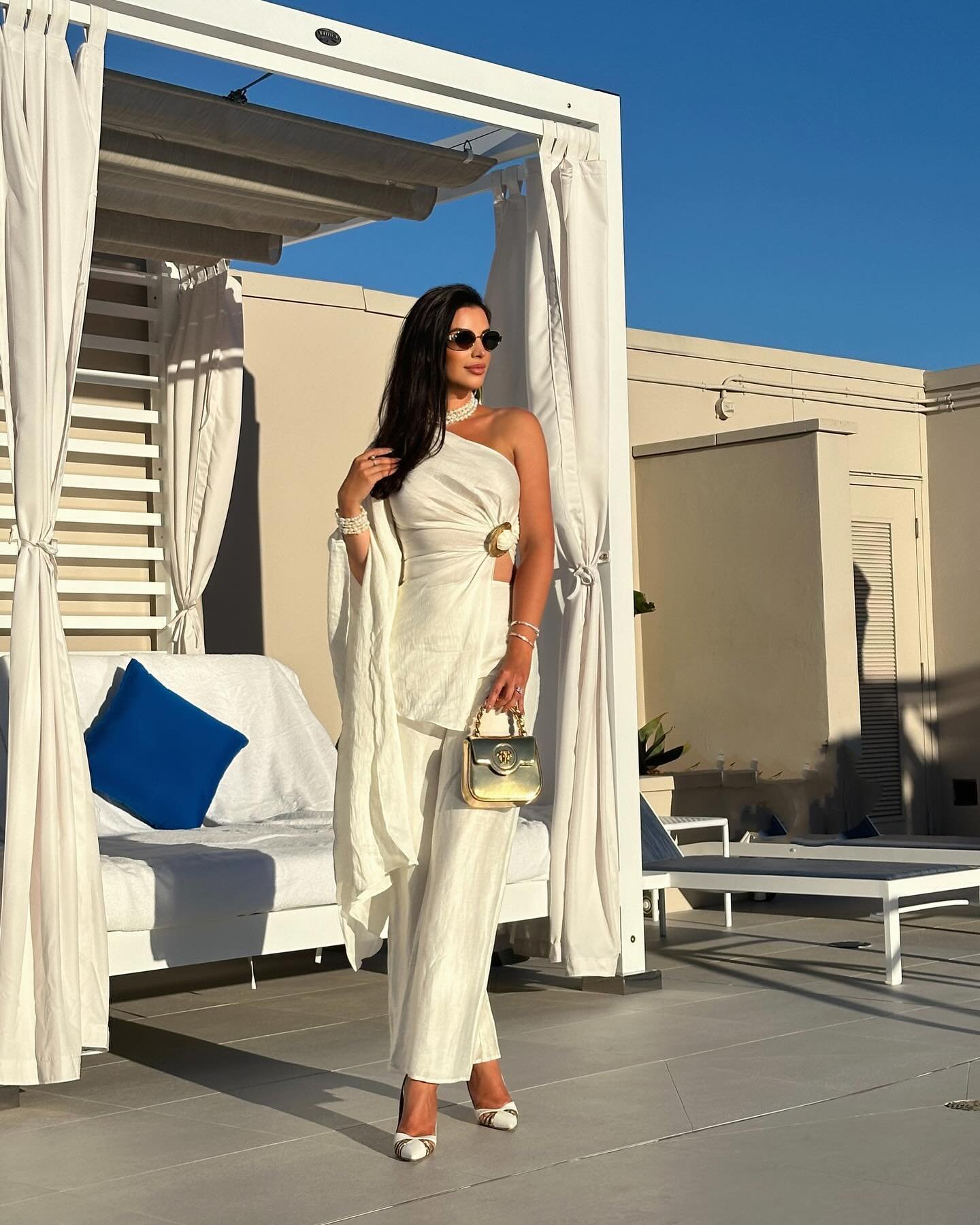 One-Shoulder Linen Set with Metallic Gold Handbag and Pearl Accents