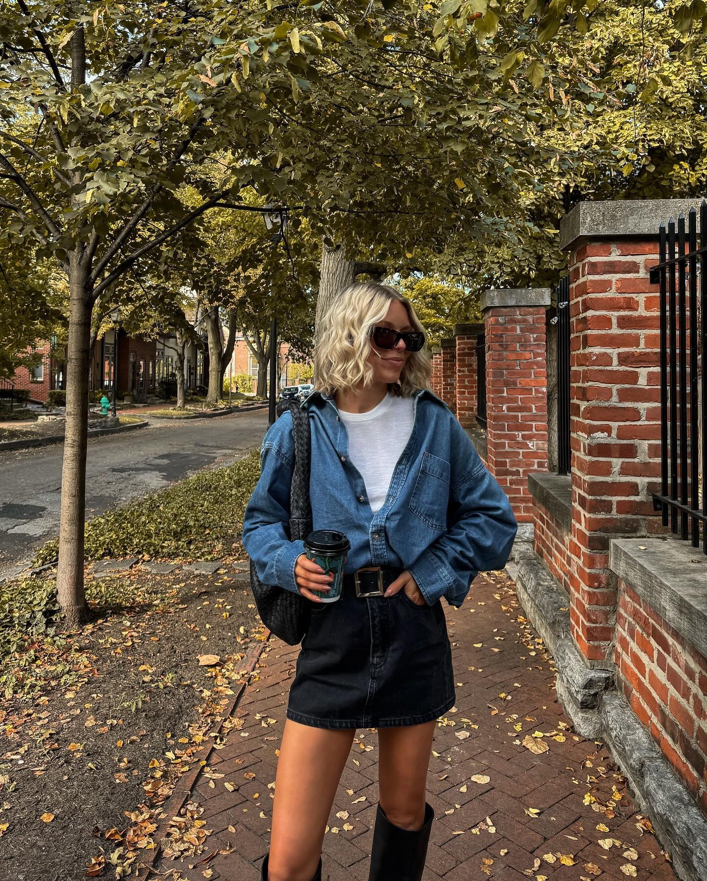 Oversized Denim Shirt with Fitted Black Mini Skirt and Tall Leather Boots Display