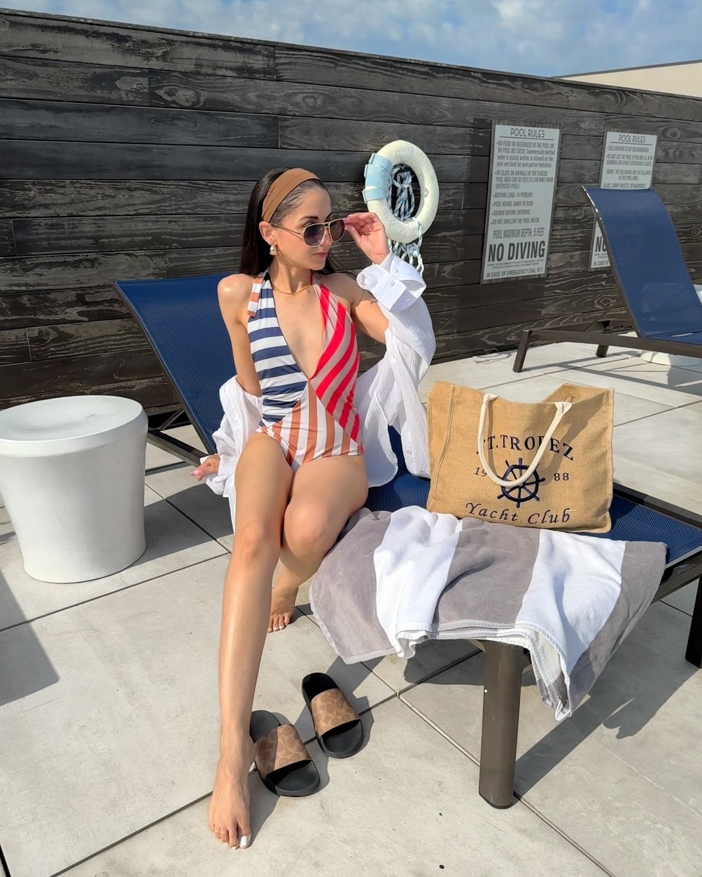 Oversized White Button-Down Shirt with a Color-Blocked Striped Swimsuit