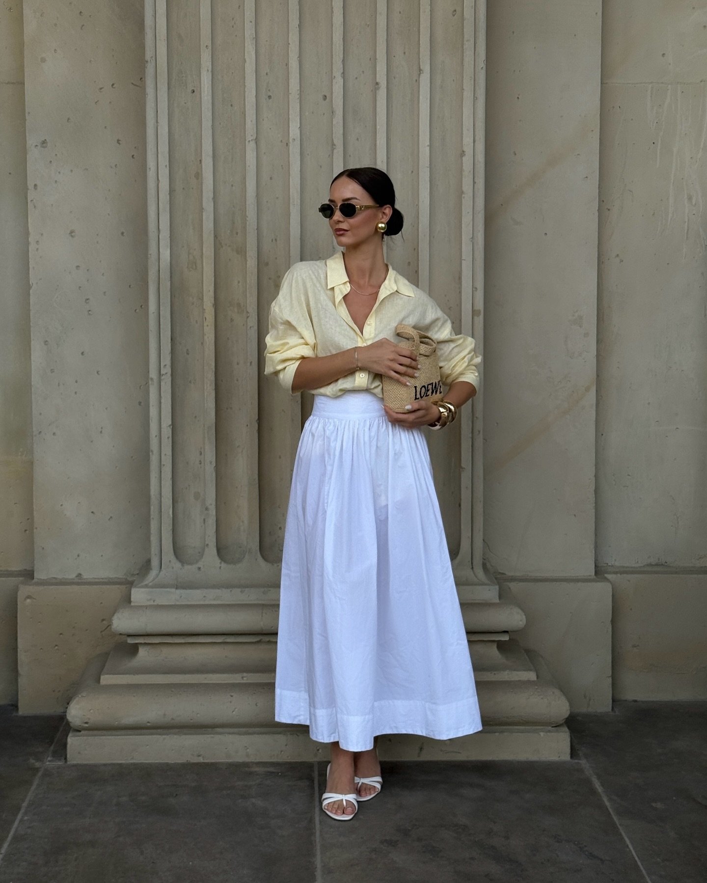 Pale Yellow Linen Shirt with Voluminous White Cotton Skirt and Straw Bag