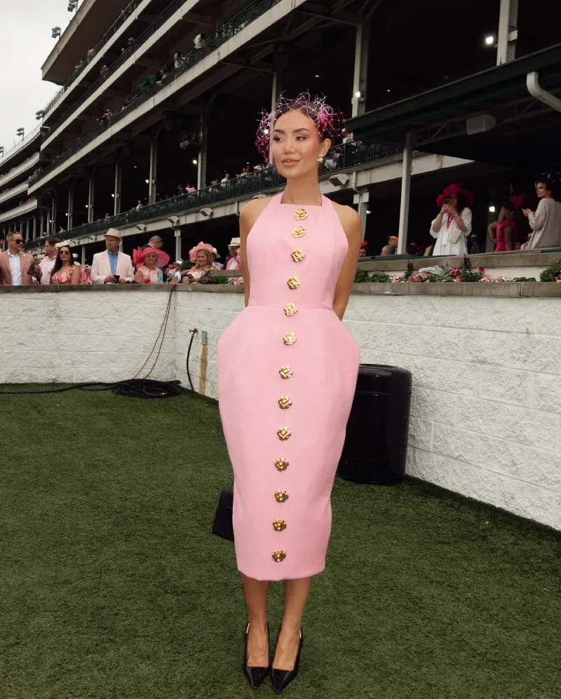 Pastel Pink Halter Dress with Gold Floral Buttons and Delicate Fascinator
