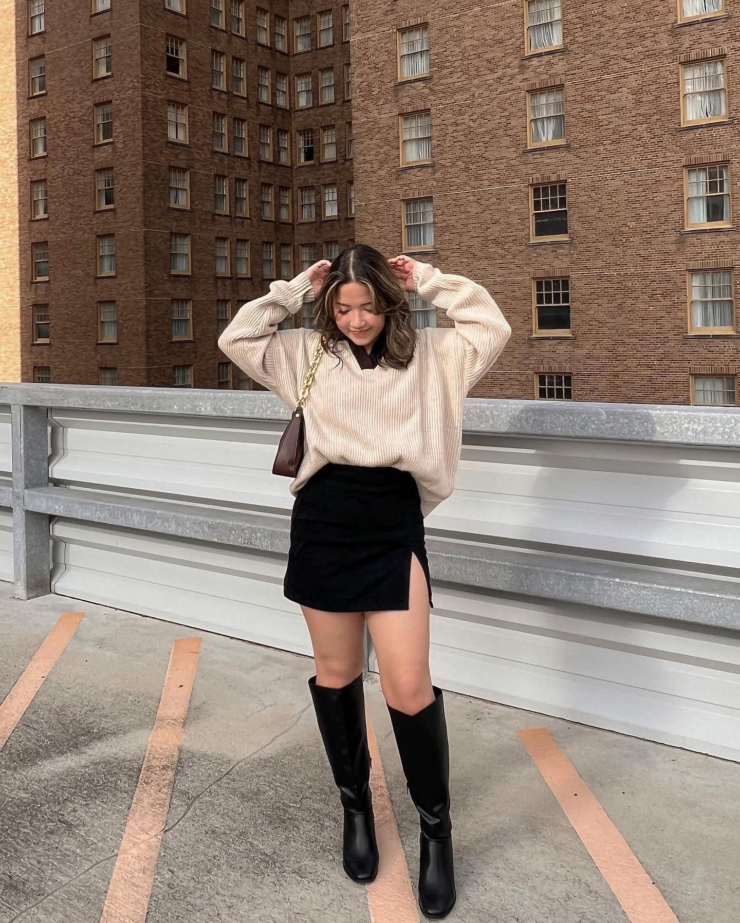Ribbed Cream V-Neck Sweater with Black Split-Hem Mini Skirt and Tall Black Leather Boots Display