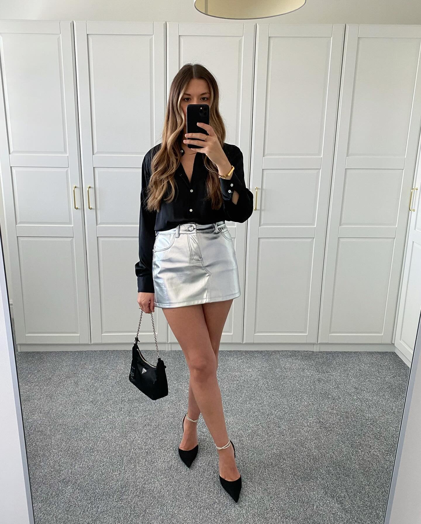 Silk Black Button-Down with Metallic Silver Mini Skirt and Ankle-Strap Pumps Display