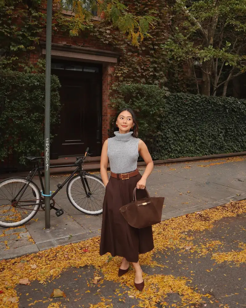 Sleeveless Gray Turtleneck Knit with High-Waisted Chocolate Midi Skirt and Wide Leather Belt