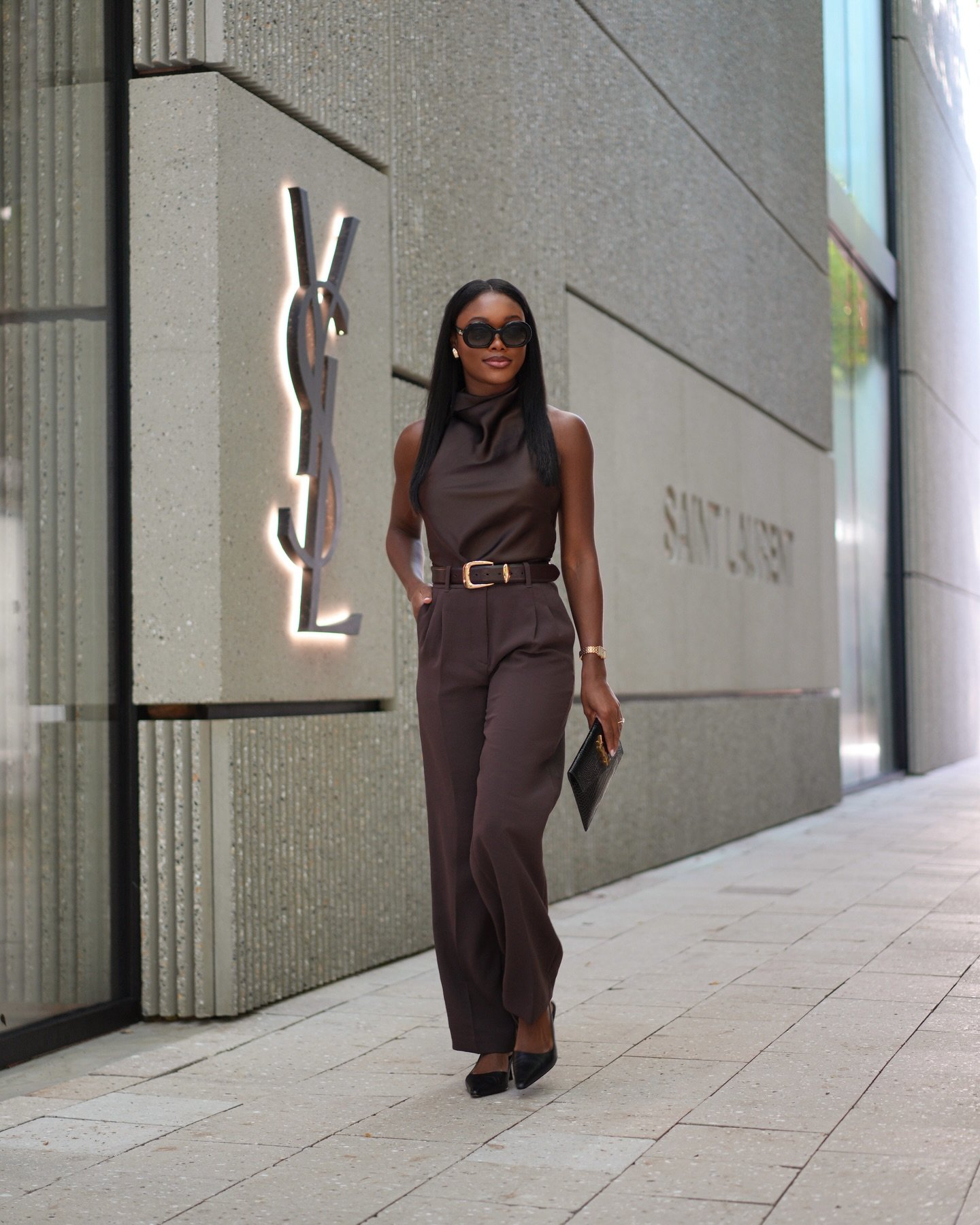 Sleeveless High-Neck Silk Blouse with Tailored Trousers and Slim Leather Belt