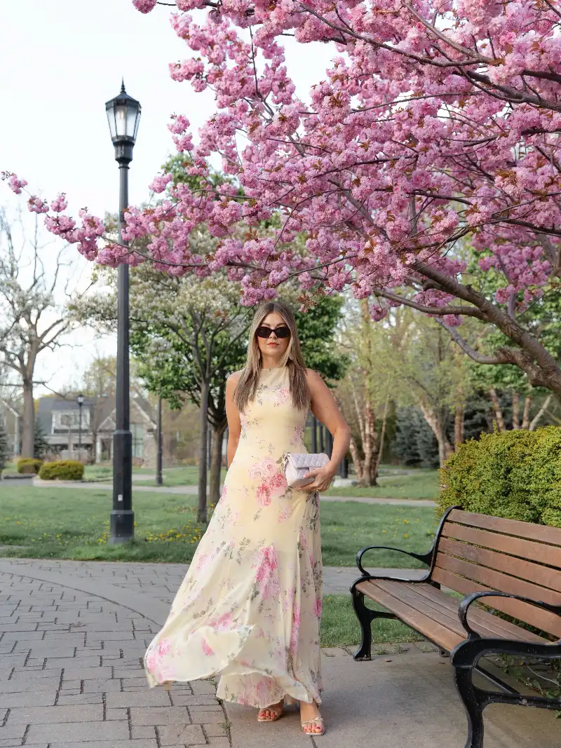 Soft Yellow Floral High-Neck Maxi Dress with Quilted Handbag and Cherry Blossoms