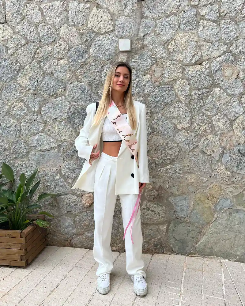 Tailored White Blazer with Pleated Trousers and Bride-to-Be Sash