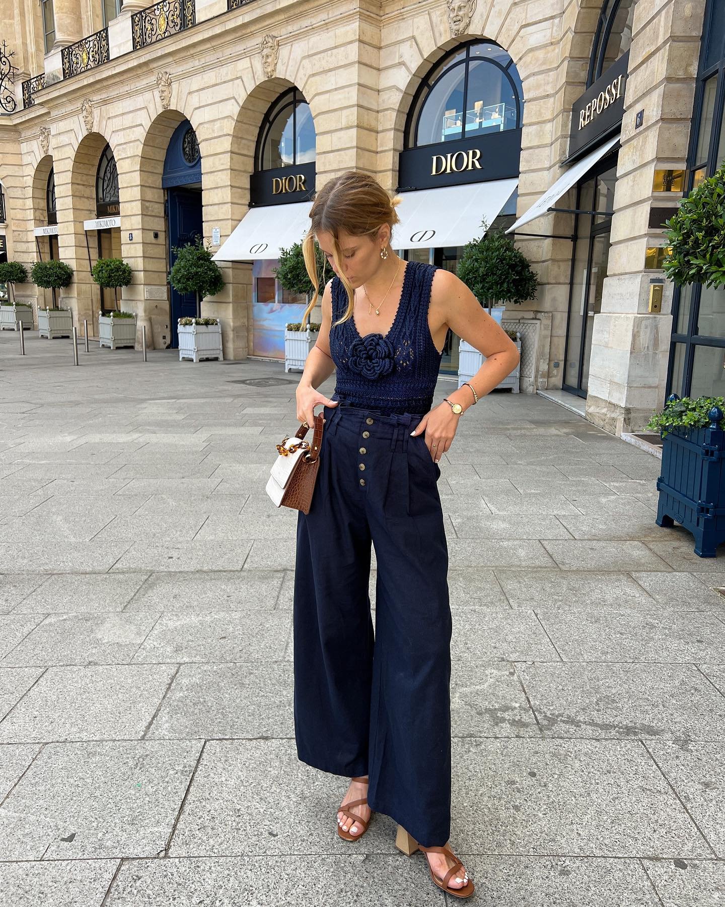 Textured Navy Crochet Top with Wide-Leg Trousers and Cognac Leather Accents