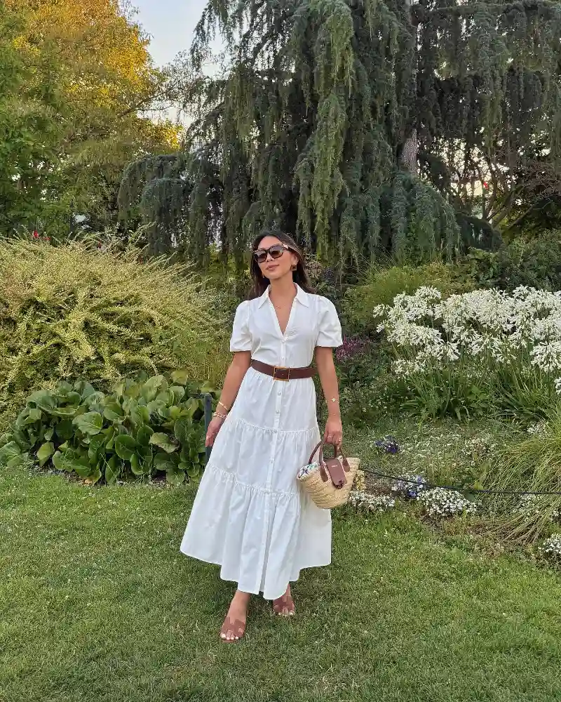 Tiered White Cotton Dress with a Broad Leather Belt and Woven Straw Bag