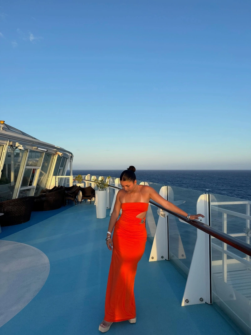 Vibrant Orange Cutout Maxi Dress with Metallic Bangles and Platform Sandals