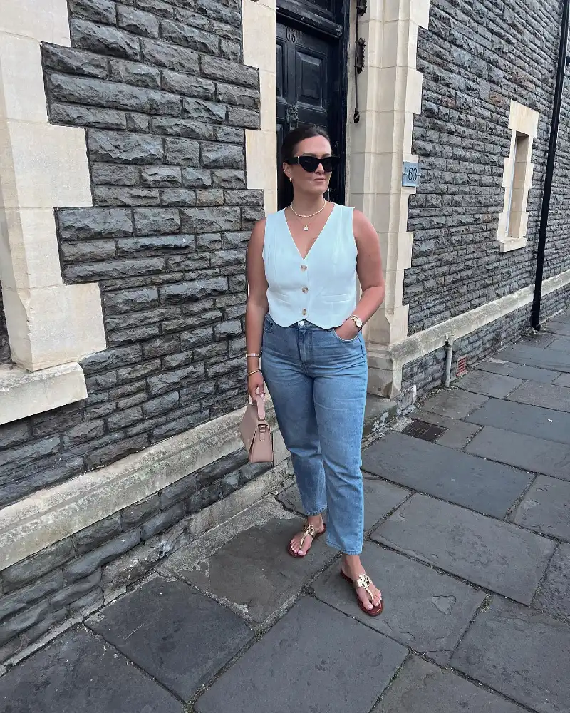 White Tailored Button-Up Vest with Light-Wash Straight-Leg Jeans and Tan Leather Sandals