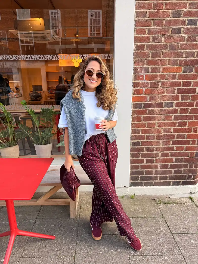 White Tee with Burgundy Striped Trousers and Draped Gray Sweater