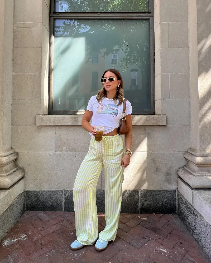Yellow and White Vertically Striped Wide-Leg Trousers with Graphic T-Shirt and Low-Profile Sneakers