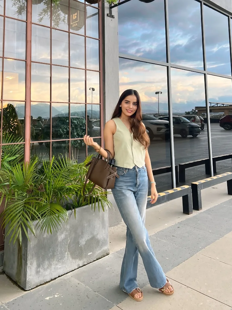  Cream Sleeveless Vest with Light Wash Flared Jeans