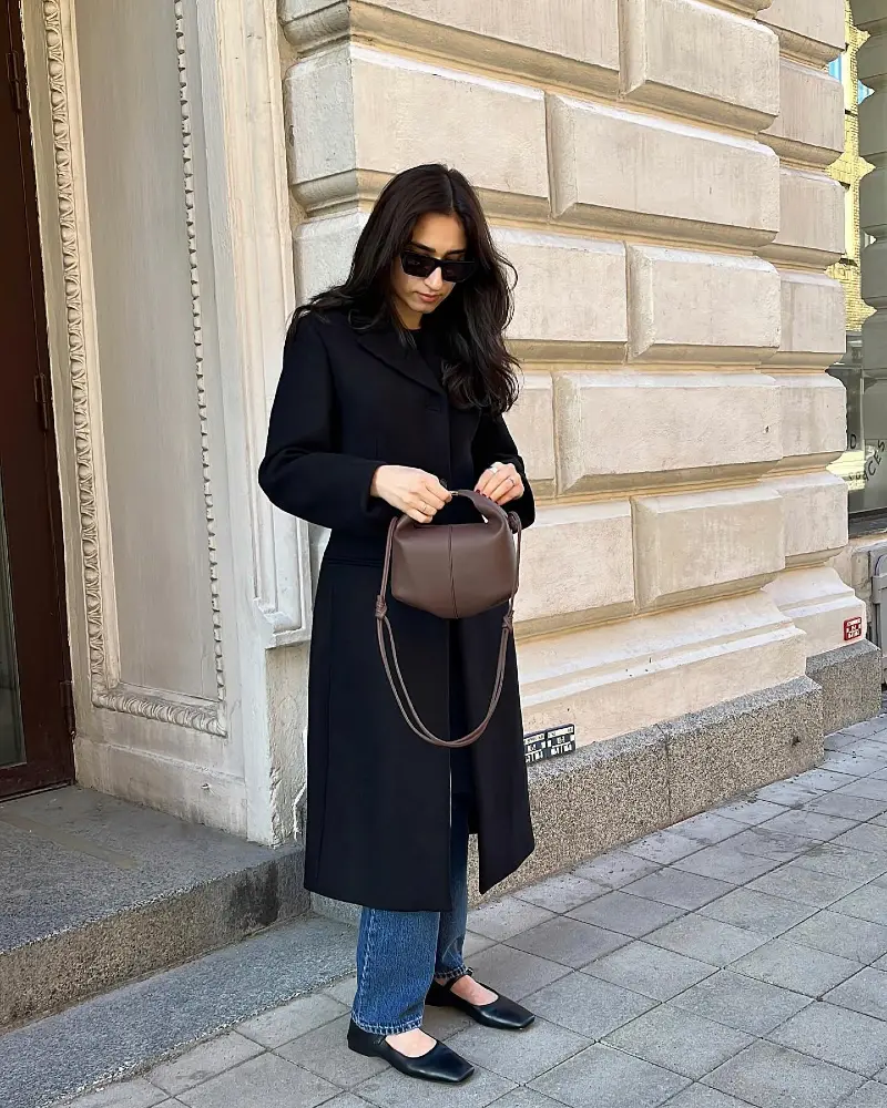 Long Black Coat with Straight Blue Jeans and Square Toe Flats