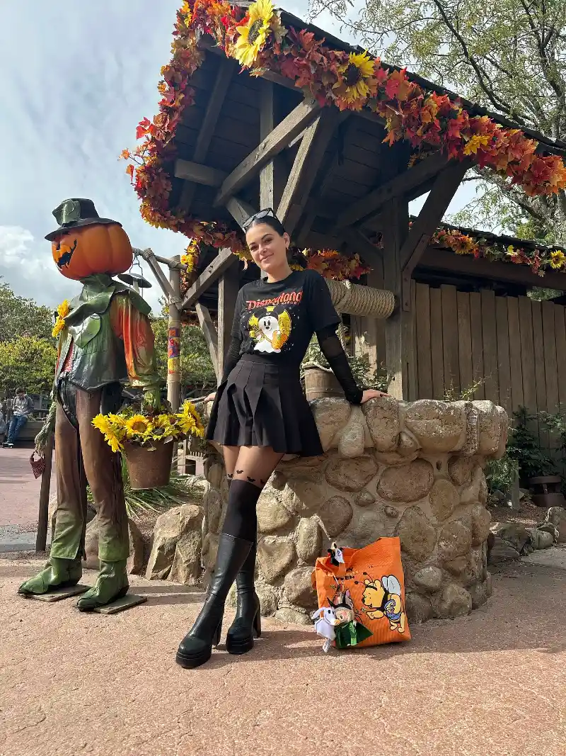 Graphic Halloween Tee with Pleated Mini Skirt and Knee-High Leather Boots