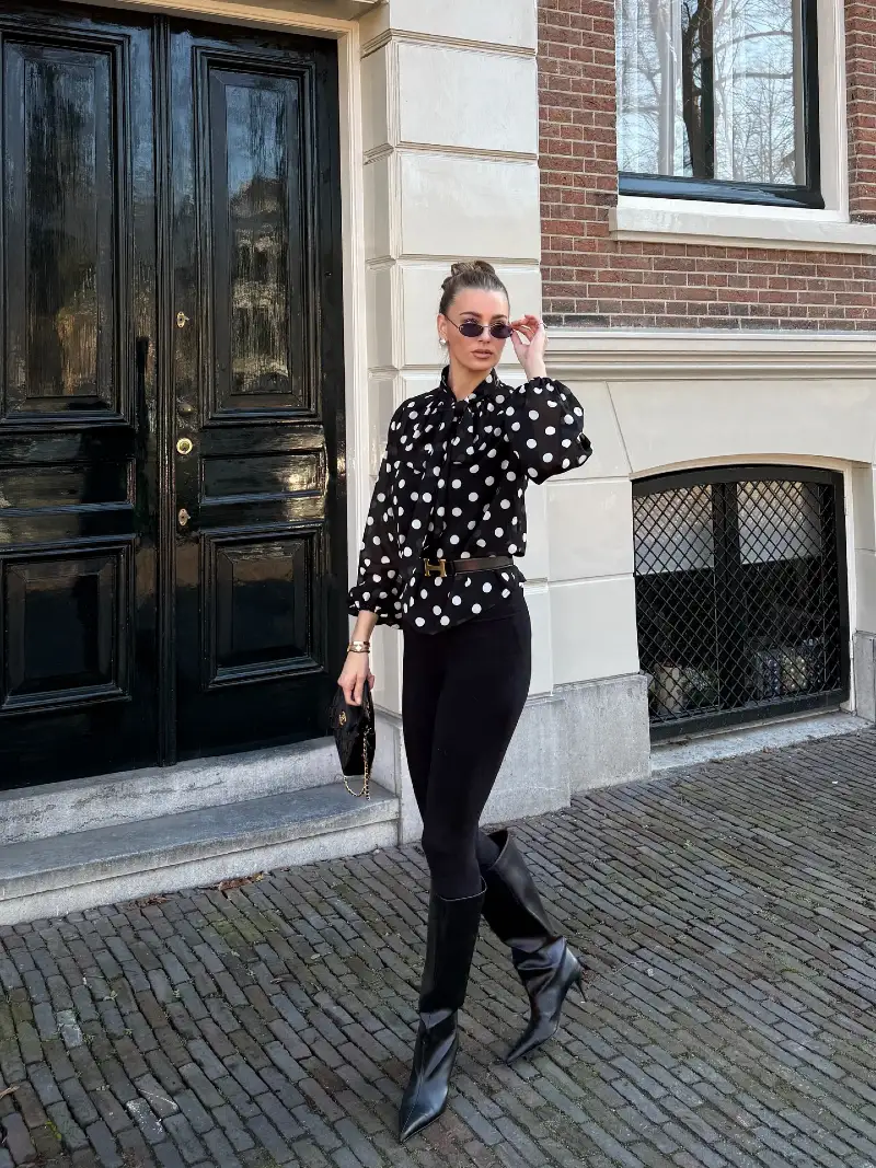 High-Neck Polka Dot Blouse with Cinch Belt and Knee-High Leather Boots